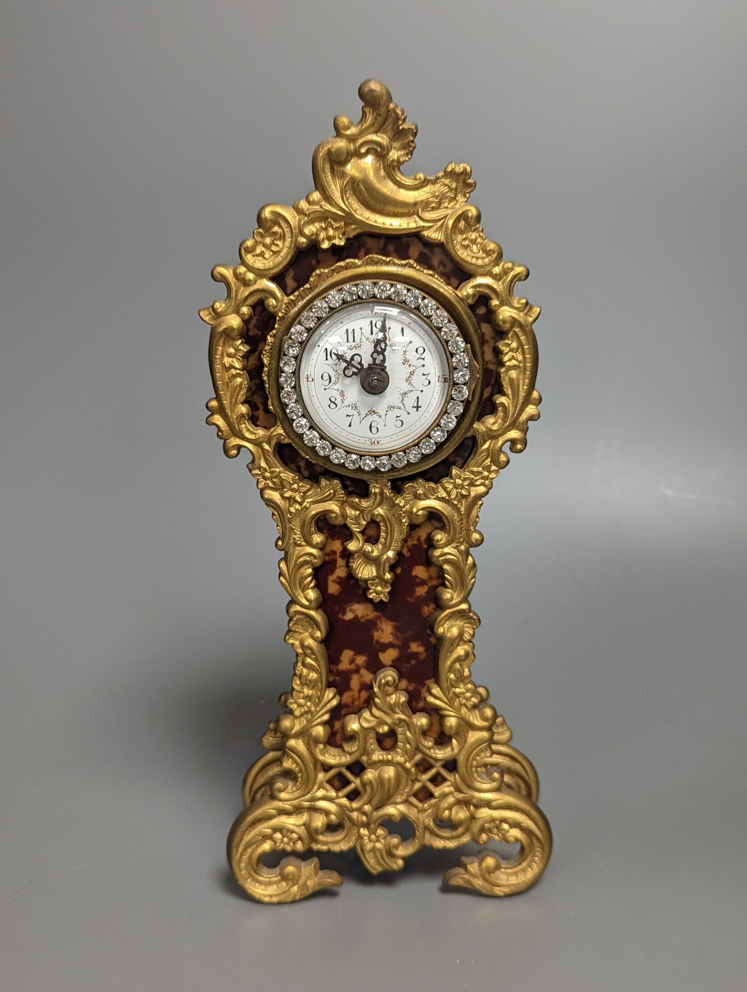 A French timepiece, with paste-set face, in simulated tortoiseshell case, height 25cm